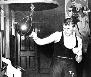 Tonypandy: Tommy Farr using a punch ball, 1937
