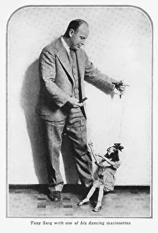 Puppeteer: Tony Sarg and one of his dancing marionettes, 1928