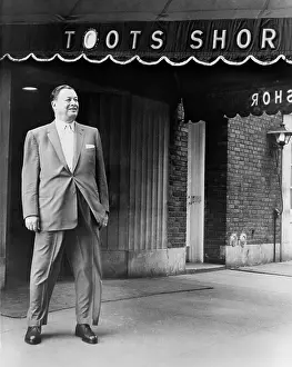 Patronized: Toots Shor in front of his famous restaurant ?
