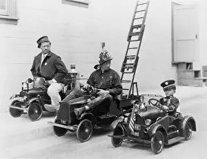 Rescuer: Three toy fire engines with child and adults driving