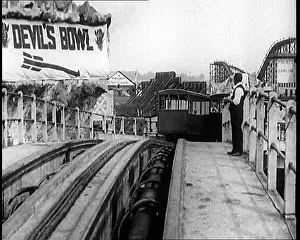 Downwards: Tracks of the Never Stop Railway. in the Background