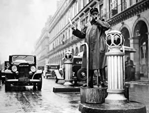 Raincoat: Traffic policeman in Paris, 1936