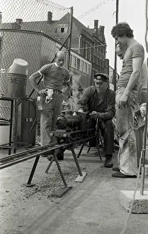 The Watts Collection: Train driver prepares engine on model steam train
