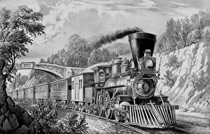 Cost: A train passing from under a bridge as part of