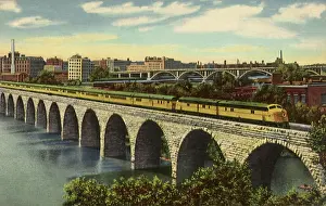 Minn: Train on Stone Bridge. Minneapolis