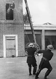 Drills: Trainee lowered from tower during exercise drill, WW2