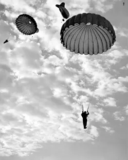 Paratroops: Trainee paratroops descending from a Barrage Balloon