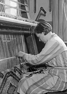 Trainee: Training on the carpet knotting machine, 1931