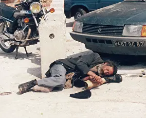 Cripple: Tramp asleep with prosthetic leg