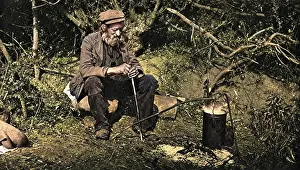 Drifter: A tramp sitting next to a fire