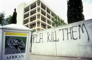 Africanist: Transkei, 1992: Graffitti in Umtata. APLA kill themracism
