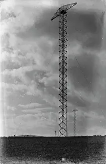 Structures: Transmission Towers Against a Cloudy Sky