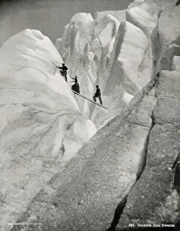 Climbers: Traversing a crevasse, climbers in the Alps