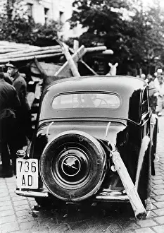 Pierces: A tree trunk pierces a car. The tree