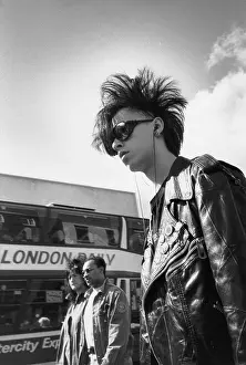 Distinctive: Trendy young man in a leather jacket and sunglasses
