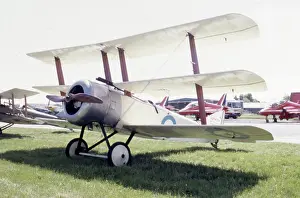 Triplane: A triplane on an airfield