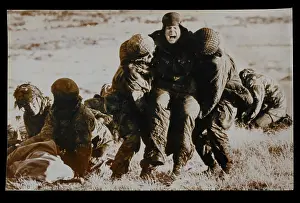 Falklands: Troops evacuating wounded under fire, Mount Longdon, Falklan