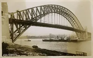 Prefix: T.S.S. Middlesex passing under the Sydney Harbour Bridge