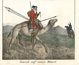Tuareg: Tuareg man mounted on a camel carrying spears