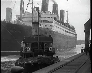 Tugboat: A Tugboat Pulling An Atlantic Liner into A Harbour