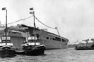 Towed: Tugboats tow the Graf Zeppelin, 1938