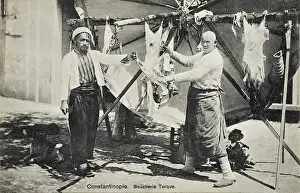 Butchery: Turkish Butcher skinning a sheep
