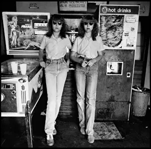Pinball: Twin girls in arcade with pintable