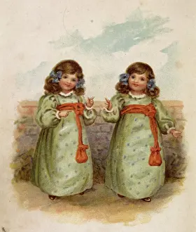 Sashes: Twin girls in identical dresses