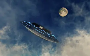 Stealth: A UFO flying amongst the clouds in the sky