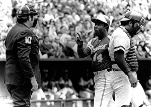 Argue: Umpire John McSherry listens to Hank Aaron ?