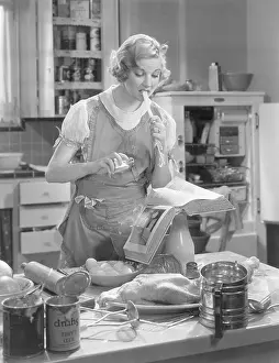 Merkel: Una Merkel at a stove