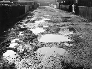 Puddles: UNADOPTED ROAD