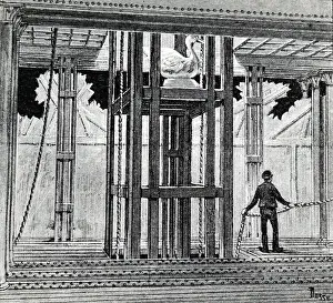 Lowering: Understage scene at the Paris Opera showing the