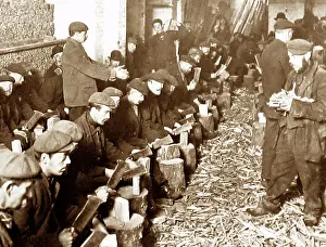 Dole: Unemployed men in London chopping sticks for firewood