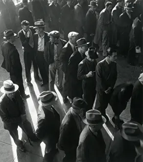 Lcgr1306: Unemployed men wait in line to file Social Security