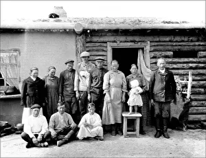 Generations: Unidentified group outside a hut