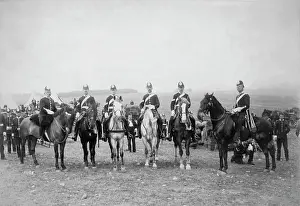 Grayham Chayney: Uniformed men on horseback in a field