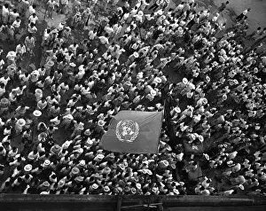 Koreans: United Nations flag waves over crowd waiting to