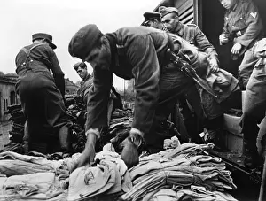 Unload: Unloading of winter clothes in Lorraine, 1944