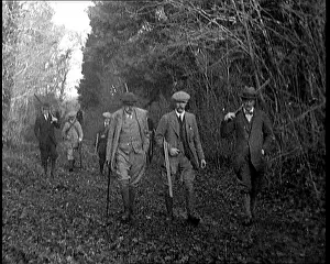 Upper Class British Men Walking Towards A Grouse Shoot