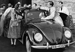 Klinger: Ursula Grabley and Paul Klinger with a VW Beetle, 1941