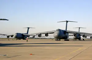 Dwarfed: An U.S. airman dwarfed by a C-5 Galaxy cargo ?