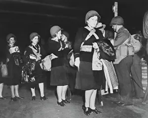 Purse: U.S. Army nurses wearing net-covered helmets, circa 1942