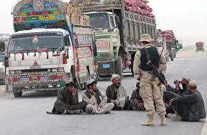 Helmand: A U.S. Army soldier with Afghani men while ?