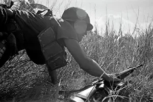 Stocktrek Images: A U.S. Army soldier ducks as a firefight breaks
