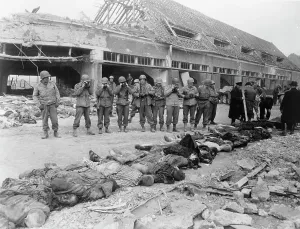 Photographing: U.S. Army soldiers photographing a row of