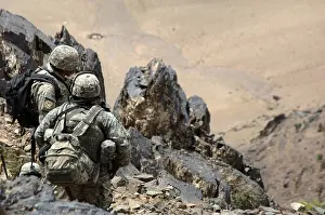 Disarm: U.S. Army soldiers search mountains in the ?