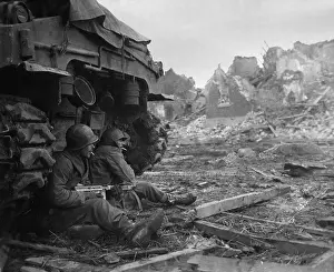 Lcgr1406: U.S. Infantrymen sheltering behind a M-4 Sherman