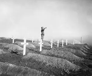 Bugler: U.S. Marine plays Taps over the graves of fallen