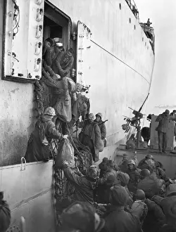 East Asia: U.S. Marines board a ship for evacuation from Hungnam